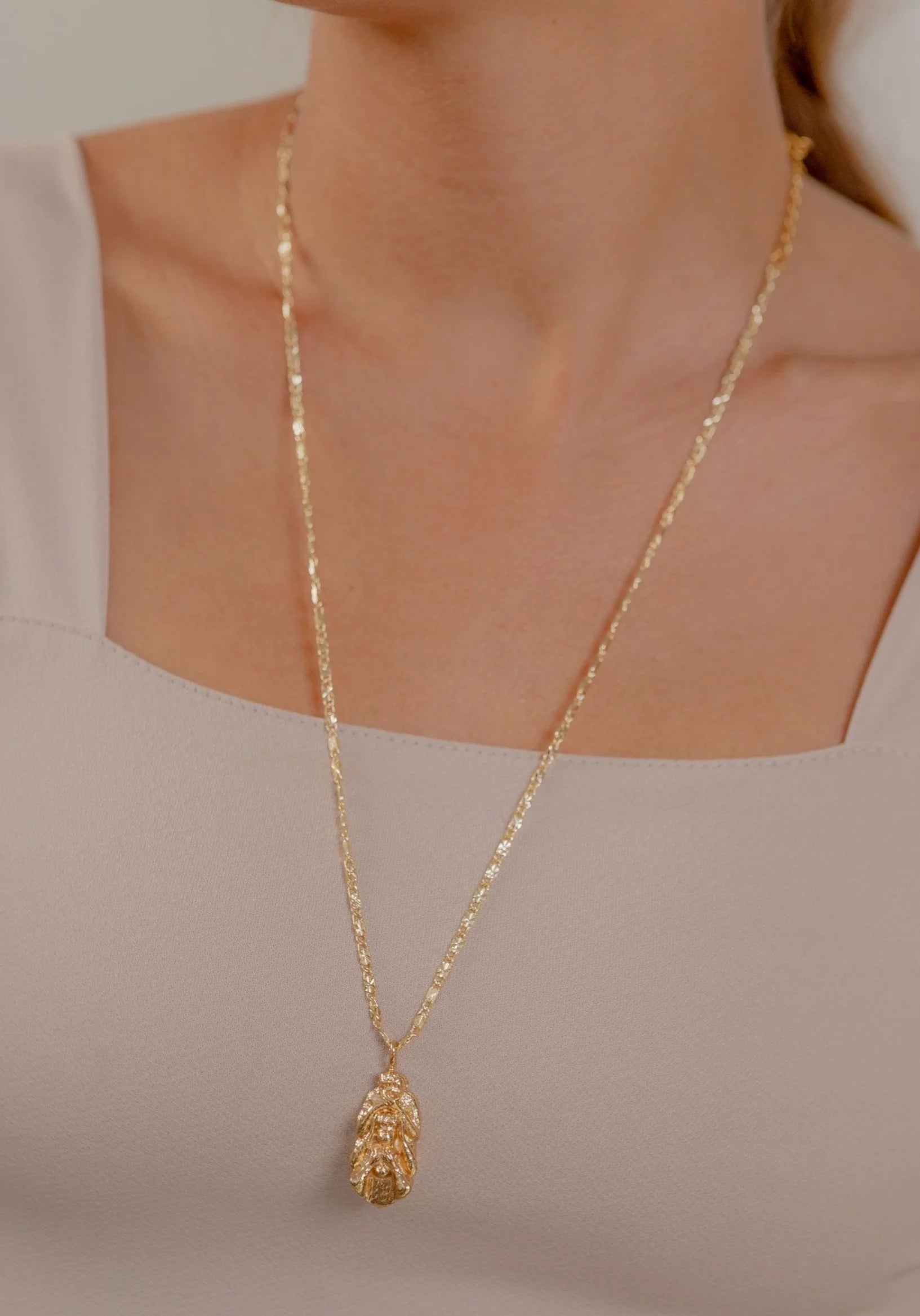 Collar Monos Tótem Coherencia